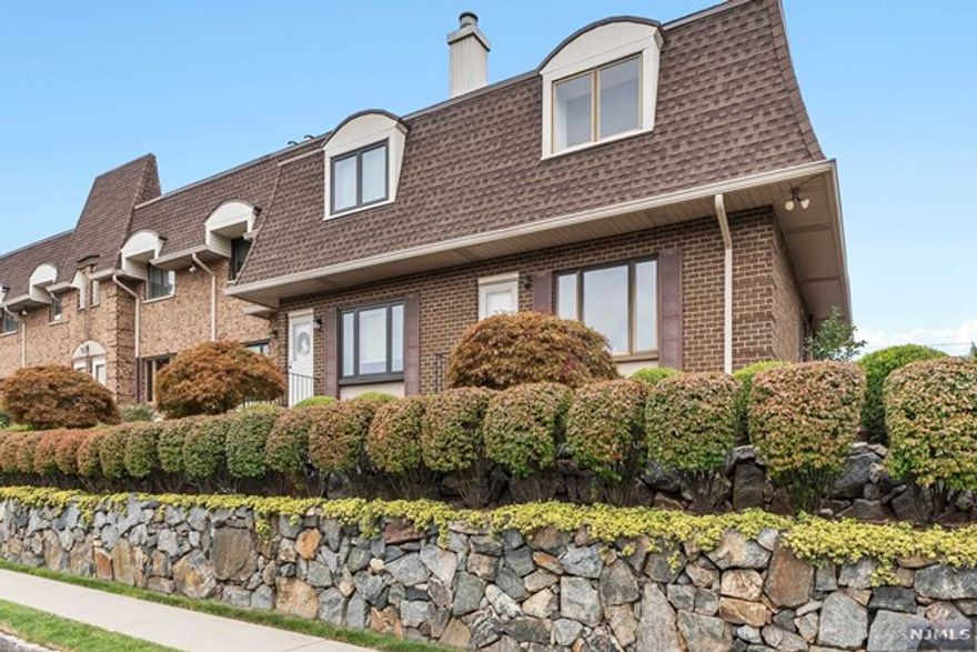 YOUR SEARCH ENDS HERE! This beautifully renovated end-unit townhouse is where style meets comfort. With 2 bedrooms and 2.5 baths, this gem offers modern updates and cozy charm. The first floor features a spacious living room with a warm wood-burning fireplace, perfect for relaxing evenings. The large eat-in kitchen is a cook's dream, featuring stainless steel appliances and ample counter space. Host dinner parties in the adjacent formal dining room. The fully finished basement offers versatile space ideal as a family room, home office, or guest suite. With a garage, laundry room, and additional parking spot, convenience is key. Upstairs, the master suite is a private retreat with an en-suite bath and walk-in closet, while the second bedroom is perfect for guests or a home office. This townhouse has it all style, space, and modern conveniences in a prime location.