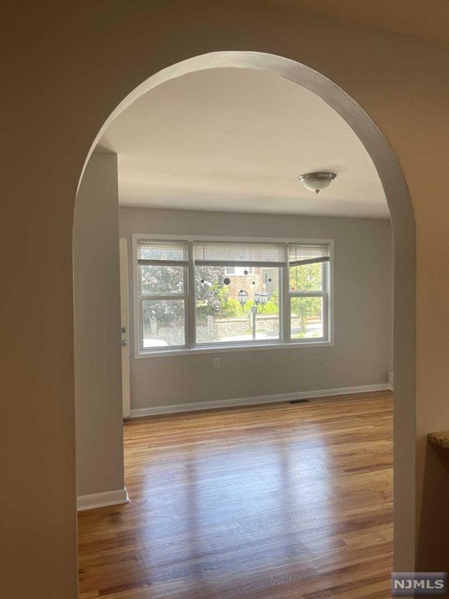 CALL LISA 973-879-6306.THIS FIRST FLOOR APARTMENT HAS IT ALL! IT IS UPDATED. SPACIOUS & HAS HARDWOOD FLOORS THROUGH-OUT.IT HAS BEEN FRESHLY PAINTED & HARDWOOD FLOORS HAVE BEEN REFINISHED. IT FEATURES A BEAUTIFULLY UPDATED GOURMET EAT-IN KITCHEN WITH CHERRY-WOOD CABINETS, AN ISLAND FOR SEATING & GRANITE COUNTERS. A BRAND NEW REFRIGERATOR & DISHWASHER HAVE BEEN INSTALLED. THE LIVING ROOM IS LOVELY, SPACIOUS & SUNLIT. THREE SPACIOUS BEDROOMS & AN UPDATED BATHROOM COMPLETED IN WHITE AND NATURAL TONES WITH A TUB/SHOWER. THE LOWER LEVEL OFFERS A GREAT SIZE FINISHED AREA WHICH CAN BE USED AS A DEN. THERE IS A 2ND FULL BATH, LAUNDRY AREA, STORAGE & A GARAGE. NOW FOR SOME OUTDOOR SPACE, ENJOY AN OVERSIZED SHARED PATIO. BRING YOUR GRILL & OUTDOOR FURNITURE. GREAT OPPORTUNITY FOR YOU TO CALL THIS AMAZING FIRST FLOOR SPACIOUS APARTMENT YOUR NEW HOME.EASY COMMUTE TO NYC AND CLOSE TO SHOPPING, PARKS & RESTAURANTS.