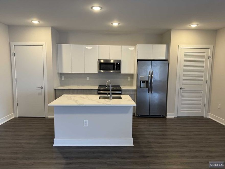 Welcome to the Metro, Fort Lee's newest luxury building. 1 parking space INCLUDED, and REDUCED security to qualified applicants - The Metro features a variety of upscale, spacious floorplans. high-end residences fully equipped w/ modern kitchens w/ stainless steel appliances, quartz countertops, full islands & tiled backsplashes, open living/dining areas, shades on all windows, modern bathrooms & a full-sized washer & dryer in each unit. The Metro features a large elegant lobby, outdoor courtyard, outdoor terrace/garden, large club room and a on-site fitness center, which includes the Echelon Reflect mirror , electric car charging stations & INDOOR (covered) parking garage w/ direct elevator access to all residences for uncompromising security. Pet friendly ! (LB limit & fees apply) Tenants pay utilities. All amenities & one garage parking space is included.