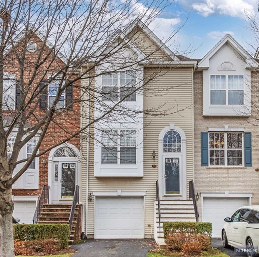 PRISTINE and SPACIOUS describes this TRI-LEVEL townhome, available for IMMEDIATE OCCUPANCY...The AMAZING updated MEIK with TONS of 42'cabinets is a chef's delight...Features SS appliances, quartz counters and pantry storage... Special highlights include GLEAMING WOOD floors and 9ft ceiling on the 1st Fl, gas fireplace, plus updated baths...Enjoy your PATIO and grill with easy access from the LR ...The bedrooms feature VAULTED ceilings to create a LIGHT and AIRY feel. The lower-level REC ROOM has a convenient POWDER room and access to garage with dedicated CHARGER for your EV...Great location with plenty of visitor parking and easy access to NYC bus and train...minutes to RT 3...wonderful GATED community with CLUBHOUSE, OUTDOOR POOL, FITNESS and TENNIS...walk to movie theater, shopping and dining. ONLY one month security required!