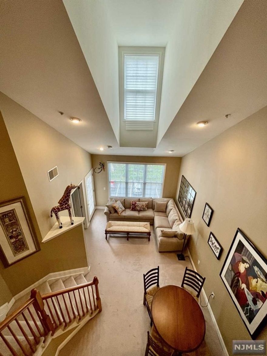 LIVE THE GRANDE LIFE! Lovely 4th floor condo w/Loft. The loft can easily be used as a 2nd bdrm or office. 953 S.F. of elegant space with vaulted ceiling. Featuring 1 Bdrm, 1 Bth w/loft & lndry rm. Primary bdrm with his/her closets and Jack & Jill bathroom. Plenty of kitchen cabinets, granite countertops, breakfast bar & SS appliances. Amazing low Riverdale taxes only $4961. Great location, near elevators. One assigned parking space in grge. Add'l parking outside. Enjoy all the amenities the Grande has to offer, 2 swimming pools, 2 club houses, billiards rooms, tennis courts, fitness centers, conference rooms, party rooms & much more. Great location near all major highways, shopping & restaurants! PET POLICY- MAX 2 PETS PER CONDO -35LB WEIGHT LIMIT PER PET. - Living/Dining & Loft photos from another listing to show layout.