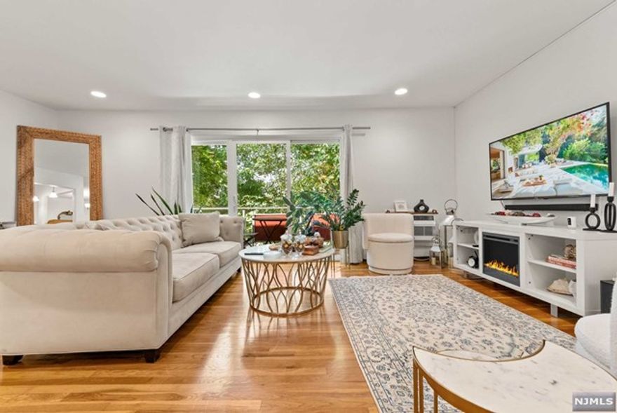 Sun-Filled, Serene, & Spacious Top Floor End Unit in a Pet Friendly Garden Style Apartment Complex. Beautiful hardwood floors through out with elegant updates. Large sliding glass door leads you to a private deck - perfect for lounging with morning coffee. Bright open layout with living room, dining area, and kitchen. Updated kitchen features stainless steel appliances, quality Fabuwood cabinetry, mosaic tile backsplash with Granite Countertops. Generous size closets and plenty of storage. Includes garage space for car and additional storage. Clean laundry room on-site. HOA includes hot water, heat, and complex maintenance. Newer roof and refreshed unit corridors without any additional assessments. Steps from the park, great restaurants, houses of worship, NYC transit. Enjoy great restaurants and venues in bordering Montclair with a short drive. Easy access to and from all major roadways. Easy and maintenance free living. Hidden Gem in the Heart of Bloomfield. Not FHA approved.