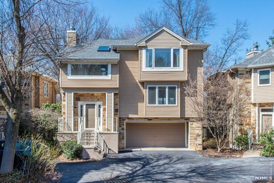 Opportunity knocks! This spacious Ascot model boasts hardwood floors throughout and has a rare deck the length of the unit! Extra skylights too!Open floor plan with several remote work space options.With updating & TLC it could be spectacular!Roof,gutters & skylights were just redone in 2019.Beautiful built in bookshelves length of living room wall.Convenient second floor laundry.Great closet & storage space.Basement can be finished.Quiet, private location & close to all major roadways.This complex is pet friendly & amenities include outdoor pool,tennis & playground.Don't miss this chance to make it your own!