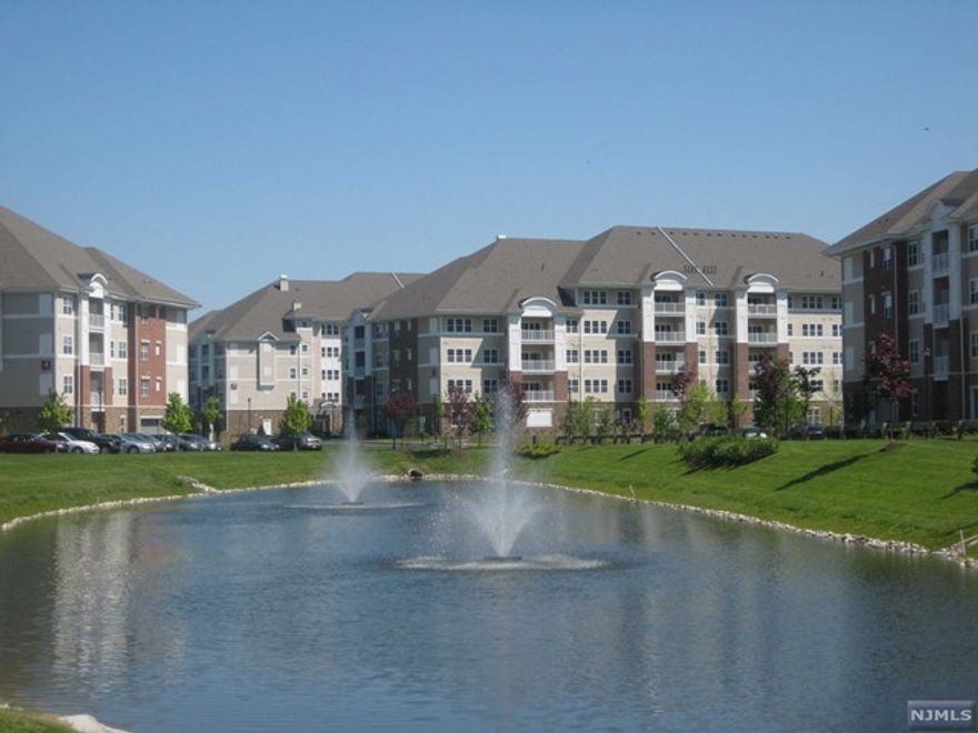 Wanaque Reserve 55 and better active adult community. Stunning Colfax model loaded with upgrades in desirable building 1 with 1,768 sq ft, open floor plan, 2 bedrooms and 2 full baths. Perfection at Wanaque Reserve! Home features: Gourmet eat-in kitchen with stainless steel appliances, granite counters & custom backsplash. Formal living room and dining rooms, den/library, master bedroom with a tray ceiling, walk-in closet and full private bath with double sinks and granite counters. Crown molding throughout most of the home, hardwood floors, recessed lighting and private balcony with extended views. Live life to the fullest at the Wanaque Reserve with indoor & outdoor pools, club house, gym, billiards, art room, theater, tennis, 40 clubs and much more! Close to major highways and NJ Transit.