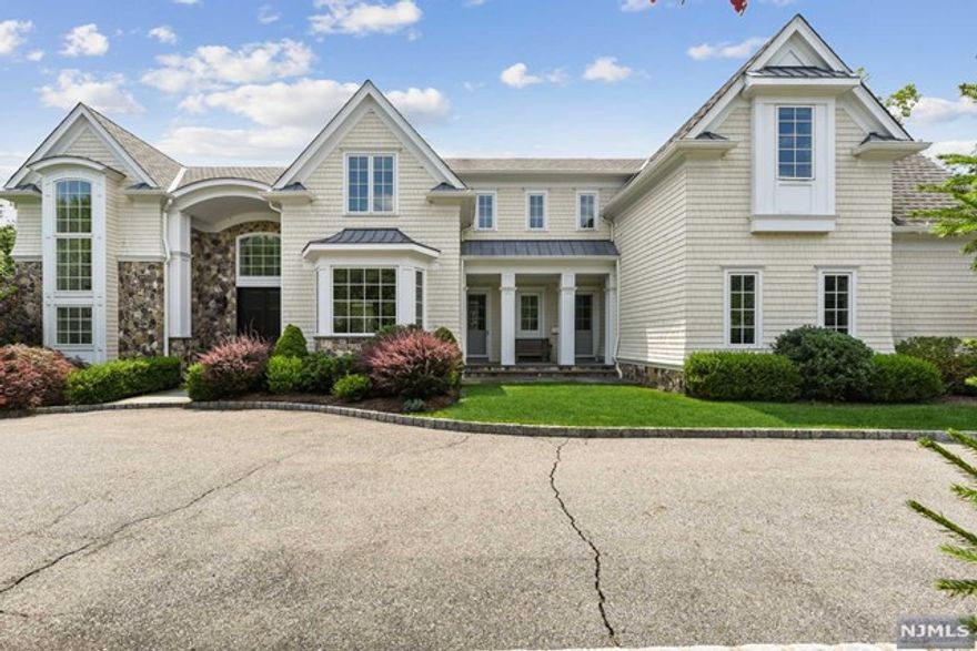 Designed & Built by acclaimed architect Robert Zampolin in 2010, 7 BR 9.5 Bth Sun-filled Colonial Modern Home located 6 miles from NYC on a flat 0.93 acre in Tenafly's prestigious East Hill. About 6,000 sq ft of living space + huge basement + outdoor entertaining space. 1st Flr: 2-story Entry foyer, 2-story Great rm w/ fpl, 1st flr Guest suite, PR, FDR, butler's pantry w/ side entrance, Family rm w/ fpl + custom built-ins, adjacent to a gourmet modern Kitchen, doors to Loggia w/ fpl offering a great open outdoor space + built-in BBQ area, Full Bth, Mud rm, back-staircase, heated 3-Car Garage. 2nd flr: Primary BR Suite w/ large bath, dbl vanities, soaking tub, shower stall & sep. WC, 2 huge WICs, 4 add'l BR suites, Laundry rm. Lower Lvl: Rec rm, Play rm, Media rm, mirrored Gym, 1 BR suite, Utility rms. Amenities: Commercial grade air filtering system, partially furnished w/ gym equipment, extensive millwork throughout, landscaping provided by landlords, credit check required