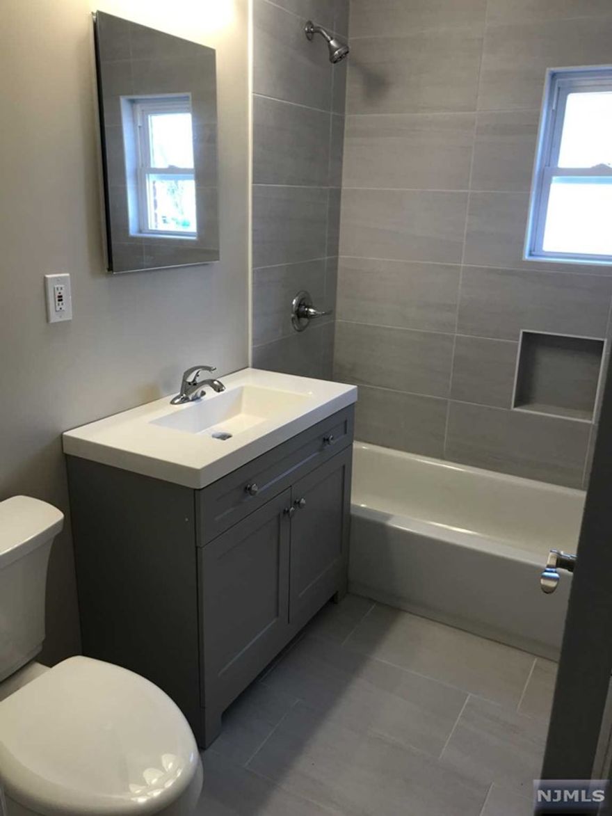 Renovated, kit w/quartz counter top, renovated bath, hardwood floors, first floor 2 entrances, 6 closet. D/W, Refrigerator provided. One car off-street parking. Heat included. Close to park, buses, Rt 80 Photos are of a similar apartment. Listing agent related to owner. Owner has NJ real estate license.