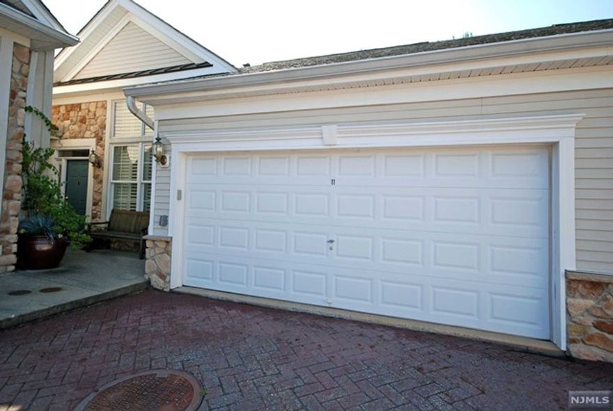 Courtyard Homes like this BURGUNDY are few & far between in this premier gated community! A superb combination of custom features, terrific updates, a flexible floor plan and outdoor space with the privacy you've always dreamed of having. The primary bedroom suite has a tray ceiling, luxurious bathroom, large walk-in & double closet (both w/wood shelf/drawer organizers). Enjoy the view from the sunroom, entertain in the living room or relax in the family room. The lower level has a recreation room, full bathroom, two guest rooms and a big storage room. Resort style living with an outstanding 25,000 sq. ft. clubhouse & the best amenities: indoor & outdoor pool, tennis/pickleball, card rooms, Mahjong, putting/driving, fitness center, grand ballroom, clubs, events & activities. Bordering Upper Montclair with great restaurants, shops & boutiques. So many added finishes to appreciate throughout this home!