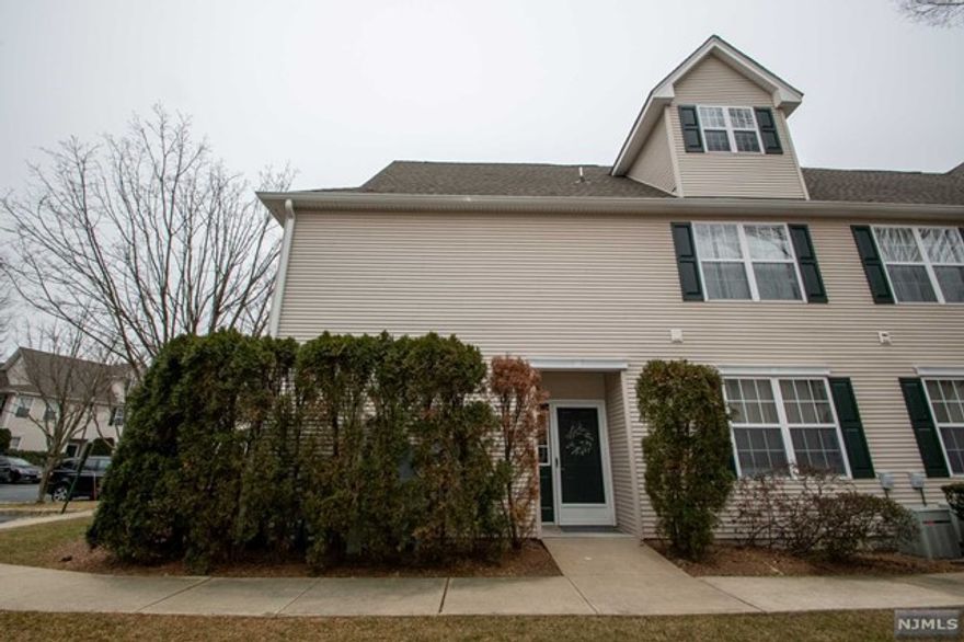 Chic first floor end unit Condo located in a desirable gated community in Morris County. A spacious foyer welcomes you to this cheerful home with high ceilings, laminate radiant heat floors with individual controls, oversized windows, and floods of natural light throughout. Entertain guests in the large and inviting living room. Meal preparation is a breeze in the kitchen complete with plenty of cabinetry, stainless steel appliances, a gas stove, and a stylish pass through. The adjacent dining area features sliding door access to the patio and yard. The master bedroom suite boasts dual closets and a full private bath. A versatile second bedroom is opposite a full bath and a convenient laundry/utility closet. Take advantage of community amenities including a pool, gym, walking trails, and a clubhouse. This home is located near restaurants, shopping, and mass transportation and is ready to be enjoyed.