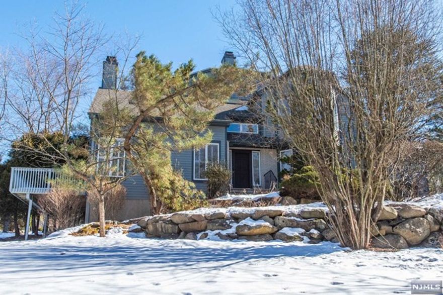 Welcome to this pristine and private end unit w/spectacular views at Fair Ridge! You will be greeted with a two story entry foyer, spacious living room and dining room with fireplace and sliders to the deck, bright eat-in kitchen w/a cozy breakfast nook, laundry room, garage entry and powder room completes the first level. Second level offers a primary suite w/high ceiling, two spacious walk-in closets, updated en-suite master bathroom, secondary suite includes spacious closet and en-suite updated full bathroom. Very large family room w/fireplace w/potential space for a 3rd bedroom as well, sliders to a bluestone patio, very large storage/utility room with plenty of potential for more finished space making this lower level the most spacious of all levels! This unit is nestled in a wooded and private setting w/gardens blooming in the spring and offering beautiful large yard space. Hardwood floors/Central Vac/High Ceiling /Skylights/Deck/Patio/garage/ privacy! Welcome Home!