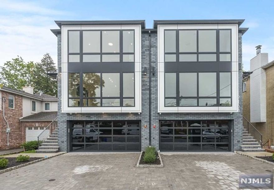 Expertly Designed & Built by SILVERLINE, this 4-level contemporary townhome sits on an oversized lot. Boasting 5BD 5BA and an the elevator, its design is accentuated by vast Pella windows & European White Oak Flooring. The gourmet chef's kitchen is a marvel w/ modern European cabinets & countertops, integrated refrigerator/freezer, wine cooler, & a grand island. Each level has its charm: the lower grants access has a full bath and grants access to a large fenced-in backyard; the 2nd level has a large cozy living space, bedroom, full bath, w/ rear balcony access; the 3rd level unfolds an expansive gourmet chef's kitchen, living, and dining w/ a private balcony. The 4th level reveals 4 tremendous bedrooms w/ 3 full baths, including a spa-like primary bath w/ heated floors, freestanding tub, and a glass rainfall shower. Equipped w/ 4-zone heating/cooling, central vacuum, smart home features, WIFI garage opener, security cameras. Located in School 1 Zone & Close to GWB