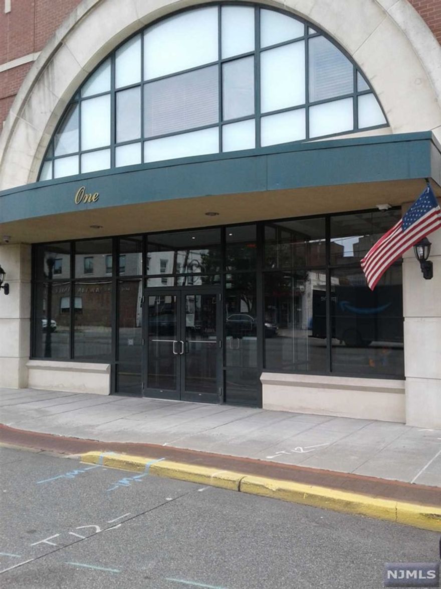 Landlord pays half of broker fee, tenant pays half of broker fee. Luxury 1 bedroom condo rental in elevator building across from train and bus to NYC. Covered 1 car parking and storage unit. Balcony off living room with skyline view. Owner supplies cold water, fios internet and basic TV. Additional pictures available. Move in flexible. Additional parking.