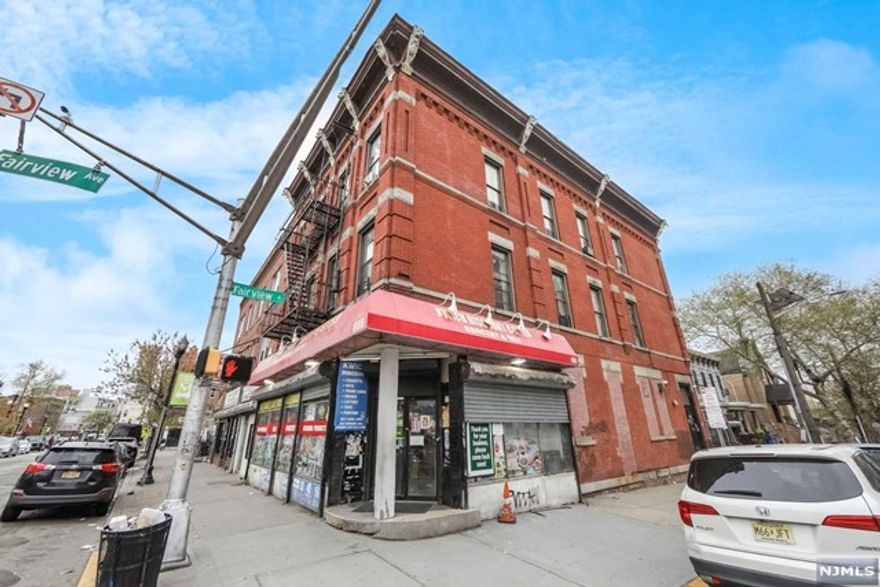 Prime Jersey City mixed-use opportunity! 4 family building with a commercial space PLUS two 2 car garage on site. 30x100 property on the corner of Bergen & Fairview. Commercial space is currently leased as a convenience store for the next 5 years. High foot traffic. Above, find 4 two-bedroom one-bathroom apartments that offer comfortable urban living. These units provide ample space and potential for customization. RARE TO FIND off-street parking in this bustling city - TWO 2 car garages in the rear of the property is a huge bonus. Situated near transit and local amenities, this property offers residential comfort and commercial promise. Don't miss this chance to shape your investment schedule a viewing today!