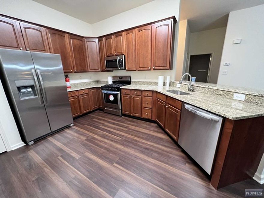 ust Renovated!!!!! Absolutely gorgeous and not to mention spacious first floor 2 bed 2 bath condo located in the lovely Four Seasons. ! NEW Floors, Newly Updated Master Bathroom, Newly Updated Kitchen with New Appliances. NEW Heating and NEW Air Conditioning Systems. An open concept kitchen to living room. High ceilings and floor to ceiling windows. A cute patio with sliding glass doors. Master bedroom with new quartz counter tops. An additional savy vanity with matching quartz countertop.Master bedroom has 2 closets and one walk in closet. Second bedroom has close access to the second full bath and walk in closet. Washer & dryer & utilities in unit.. Convenient elevator to indoor garage assigned space has large storage unit. And thats not all! Enjoy summers by the pool, play a little tennis, bocce or pickle ball. Clubhouse has gym, pool table, table tennis and card room. A kitchenette and event space. Lots of events and activities to join in this amazing community.