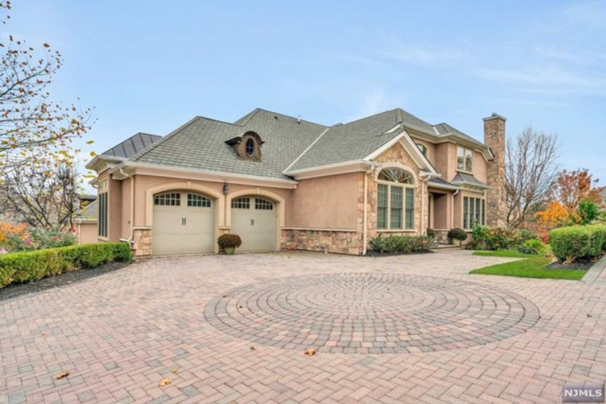 Upgraded and exceptional luxury townhome located in a prime location at desirable gated Bear's Cove. With over $200K in upgrades, this turnkey home conveniently offers a first-floor primary suite and an open floor plan, ideal for today's living. An impressive two-story entry leads to a dining room & family room with transom windows and a gas fireplace. The gourmet kitchen has a seated peninsula and eating area with access to a private deck to enjoy your morning coffee or dinner with views of the lush backyard, pool & Ramapo mountains. Upstairs houses two bedrooms and an office in the awesome loft area. The outstanding finished lower level is perfect for entertaining with a full bar, buffet area, surround sound home theater, billiards, full bath, large storage area, and daylight big window. Bear's Cove is a resort-like gated 55+adult community conveniently located to shopping, dining and NYC transportation. Enjoy luxury living at The Cove!