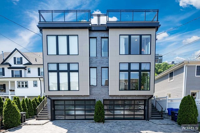 Beautiful 3000+ Sqft modern Townhouse on one of the most desirable streets in Edgewater with Hudson river & GWB views; walk to veterans park, bus, ferry (12 mins to Manhattan), elementary school, and shopping. Main level has Modern kitchen with Large quartz island, pot fillers, Custom built-ins, Professional 36 inch Wolf Range, 42 inch Sub Zero fridge and Wine Fridge. Large Living Room, Dining Room and a marble powder room on the main level. 2nd Floor has Primary Bedroom Facing the Hudson River, Large custom closet and Spa like marble bath with Steam Shower and Radiant Heated Floors; two additional Bedrooms with custom closets and 1 bath. Top Floor has a custom Office/ Entertainment Room with half bath and Views of the Hudson River and GW Bridge. Roof deck has hook-ups for Gas BBQ for outdoor entertaining. Lower Level has a Garage, 4th Bedroom and full bath. Additional features include Custom Blinds & curtains built in pantry/storage, water softener, reverse osmosis water purifier