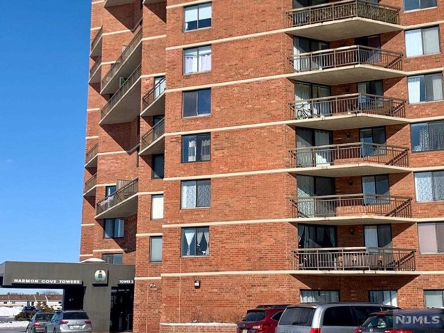 2 bedroom condo in an elevator building in Harmon Cove Tower 3. 1085 sq ft. Laminated floors throughout. Washer & dryer under the kitchen counter. Panoramic views from balcony and both bedrooms. Luxurious amenities include: 24-hour concierge service, gym with sauna & steam room, outdoor pools, tennis courts, basketball court, playground, nursery, game room, and NYC buses at door. Conveniently located near Rt 3, Turnpike, Meadowlands, and Lincoln Tunnel. One deeded parking space #438 included. Additional parking space and storage can be rented through condo management. Photos taken prior to current tenant moving in over a year ago.