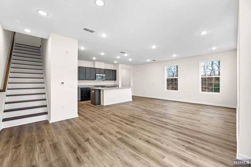 Brand new,End-Unit home that offers the privacy you need, endless amenities & stress-free living at a great price; located at Crossings at Dunellen is just for you! This newly built END-UNIT townhouse comes fully upgraded with open floor-plan, tons of windows facing lush green courtyard, beautiful private patio.Through the foyer you will enter the main level of the home that offers upgraded kitchen with over-sized island, tons of cabinet space, pantry, dining area,perfect amount of both indoor/outdoor entertainment space, a full bath, lot of storage space, attached car garage with additional driveway.On to the second floor; as you enter the hallway notice a spacious Master Bedroom with Ensuite bath that has double sink vanities, shower, a large closet,2nd bedroom,an additional full bath & laundry are all on this level. endless amenities like;clubhouse/pool/gym/well-maintained landscaping. 30 Year Tax Abatement & has all builder warranties in place.