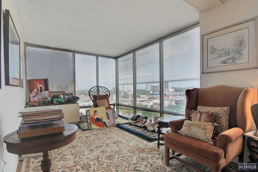 Sunny all day! Corner 2 bedroom apartment--Entry, galley white kitchen WITH breakfast area and newer plank tile floors, glass sun room, large living room, parquet floors, The glass enclosed room can be a den, solarium, dining room, or office. Primary bedroom ensuite with 2 walk in closets, 2nd bedroom, hall full bathroom. On site management office, gym, doorman and concierge. Downpayment--25% minimum, 4 to 1 income to debt ratio for board approval.