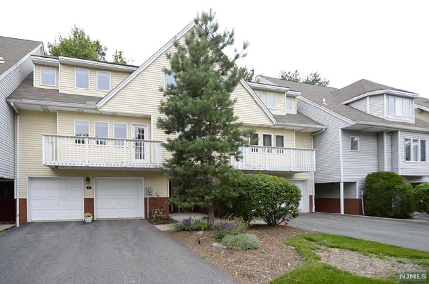 Set in the most desirable location in Glen Rock Iris Park. This stunning multi-level unit offers 3 bedrooms,3 full baths. Enter into two-story living room with large wall to wall windows, gas fireplace and entrance to deck with a patio area. The second floor with a modern eat in kitchen and a sizeable pantry, bedroom/den with a closet and front balcony. Third level features laundry area, two MBR each with full baths and walk in closets. Other features include hardwood floors, finished basement, two car garage. Highly ranked school system, transportation to NYC and much more.