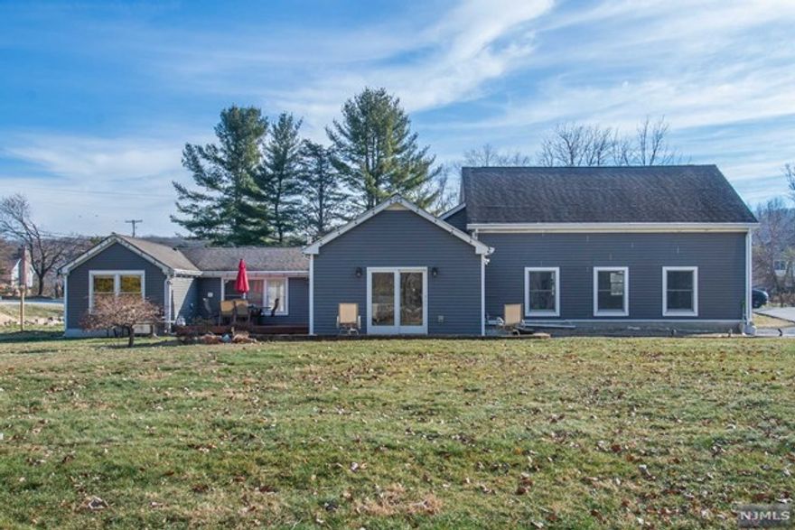 Beautiful, Sprawling, Ranch! Fabulous Floor Plan & Recently Renovated. The amount of flexible living space is impressive. Bright & Sunny. TONS of entertaining space inside & out. Large living room opens to the dining room. Functional kitchen w/ SS appliances & granite countertops! 3 bedrooms & 3 FULL baths. Two bedrooms include their own private en-suite. The primary showcases a large walk in closet. Tons of storage in the 2 car garage. Large, level yard with deck, patios & play set. LAWN MAINTENANCE included in rent! (Gas powered snow blower in garage for convenience) Corner lot located on the scenic Rockaway River. Dead end street. Pets allowed! Short walk to Peace Pipe Country Club (Golf), The Tourne (which includes acres of hiking trails), Saint Clare's Hospital and Downtown Denville. Easy access to major highways & NYC Direct Transportation. You can't beat the location.