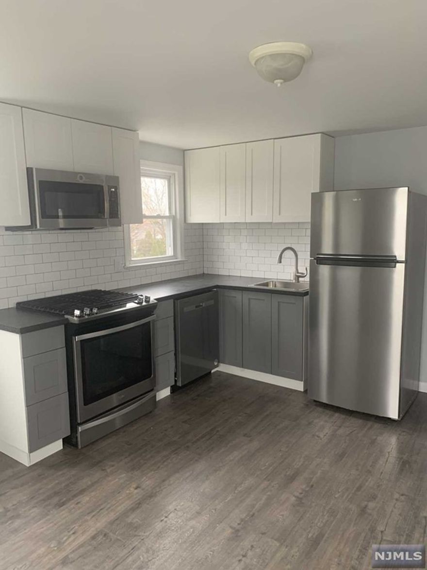 Be the first one to move into this bright 2 bedroom dwelling on the second floor in owner occupied 2 family home located in Lyndhurst. Heat, cooking gas, hot & cold water are included . Professionally renovated, featuring new MEIK, paint, hardwood floors throughout-apart for the bedrooms (approx. 11x12) with wall to wall carpeting. Remodeled bathroom. Beautiful, new eat in kitchen with new appliances including dishwasher! Great neighborhood in close proximity to NYC, Meadowlands Sports Center, shopping, dining and laundromats. Lovely park nearby in a great, friendly community. Street parking, no pets, no smoking of anything. Proof of income, solid credit score, interview.