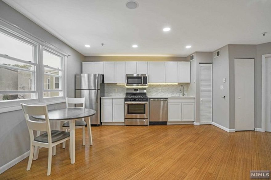 A Turn-Key Renovated Smart Home. 1 bed w/ Garage Parking & open layout. This home offers an amazing location close to shopping & transportation in a boutique styled building. The Kitchen has Brazilian white quartz counters, Brand New energy efficient SS appliances, all new cabinetry & under & upper cabinet lighting. The spacious 1 bed can accommodate up to a queen sized bed & has an oversized closet. The Living & Dining areas are great for entertaining. There is a spa-like bath w/ a walk-in-shower, designer fixtures & vanity. This is a smart Home with an Amazon Alexa HUB, smart light switches, thermostat, front door lock & Bluetooth recessed speakers. In home washer/dryer, NEW Furnace, LED recessed lighting, new windows, newly refinished bamboo hardwood floors, newer Hot Water Heater & Central HVAC. Near Blvd East & a block to Bergenline Avenue, this home offers commuters convenient options to NYC Buses, Ferry, NJ Transit LightRail that leads to the PATH, Hoboken & Jersey City!