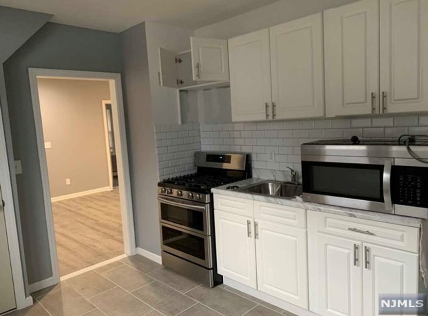 Modern apartment on a 2 family house featuring 2 bedrooms, 1 bath, kitchen, living room. Designated off street parking for up to 2 cars included. TENANT PAYS BROKER'S FEE!