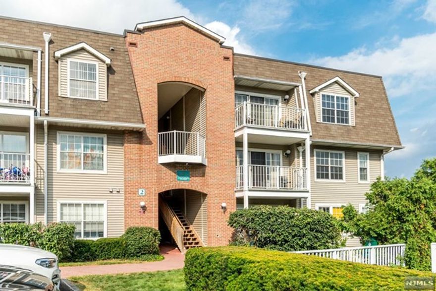 CROWN VILLAGE - This is a bright 2 bedroom 2 full bath second floor corner unit with southern and eastern exposures. Beautiful hardwood floors throughout, open kitchen with stone counter tops, and a private balcony off the living room. Washer/dryer in unit. Central heat & AC. One parking space included in rent, 2nd parking space available at $35/month and plenty of visitor parking. Crown Village community offering amenities such as security guard, swimming pool, and gym. Easy access to NJ Transit Bus & NY Waterways Ferry and within walking distance of Whole Foods, Trader Joe's, and nearby restaurants. Due at lease signing: 1 month's rent, 1.5 month security, 1 month broker fee.