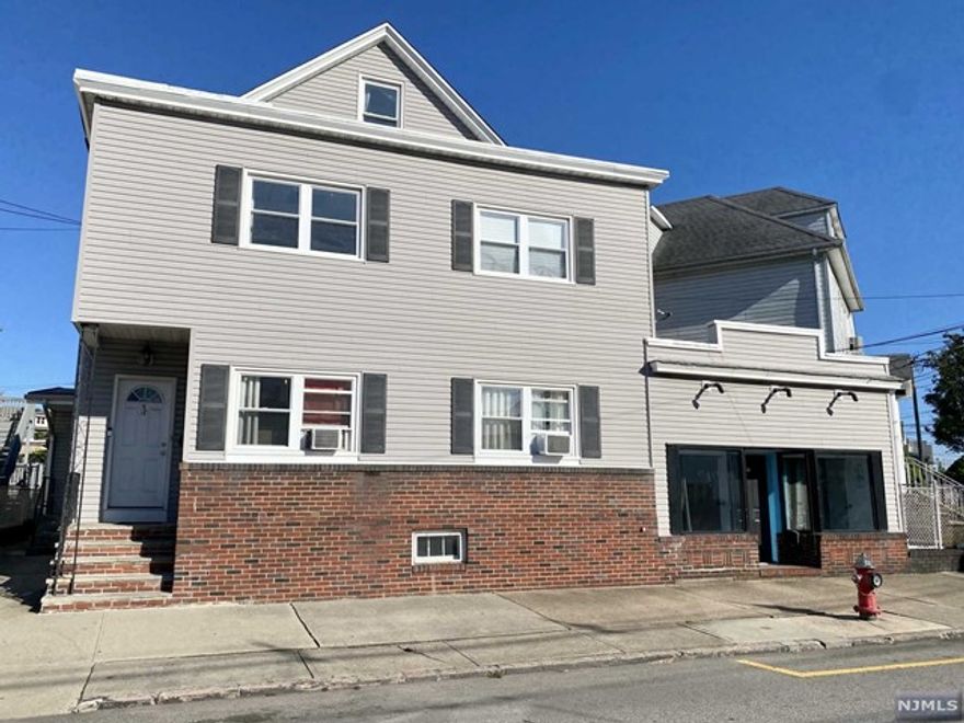 This impressive property comprises three units - 2 apartments plus a storefront. The first-floor unit boasts three bedrooms, one bathroom, a kitchen, and a spacious living room. On the second floor, you'll find a two-bedroom unit with one bathroom, a kitchen, a living room, and a sunroom. Additionally, there is a generously-sized attic. As a bonus, the third unit is a beautifully renovated storefront featuring new hardwood flooring, central air and heating and a bathroom a fantastic investment opportunity! The property also includes a substantial unfinished basement, perfect for storage needs! Moreover, its proximity to the Garfield Train Station adds to the convenience of this location. This low-maintenance property, offering income-generating potential, solidifies its status as a sound investment.