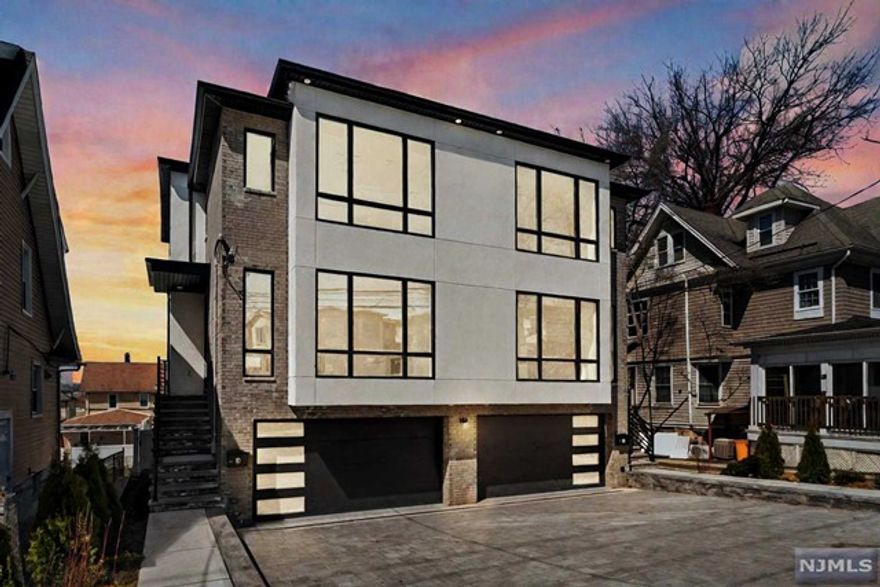 Stunning & oversized duplex in ultra-desirable Palisades Park. 145 Grand Ave Side A & B is a gorgeous BRAND NEW build with oversized layouts. Each side features 5 bedrooms, 3.5 bathrooms, a 2 car garage & an oversized driveway that can fit 4 cars (in each driveway!) Quality craftsmanship is evident throughout. Main level features a large LR, DR, chef's Kitchen, 1/2 bath & family room w. SGD that lead to a large Trex-Deck & backyard w. privacy fencing between the units. The gourmet kitchen boasts quartz countertops, custom cabinetry, oversized island w. waterfall, SS appliances & wine fridge. 4 bedrooms, 2 full bathrooms, & laundry on 2nd level. Primary bedroom suite features double walk-in closets & a spa-like primary bathroom w. floating vanities, a soaking tub & oversized shower. Lower level features 5th bedroom, full bath, wet bar w. bev. center, addt'l fam. room & mud room. TALL ceiling heights. You will be thoroughly impressed! Entire structure also For Sale for $2,559,990.