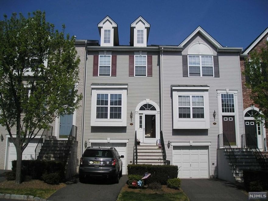 GORGEOUS TRI-LEVEL REGENCY MODEL TOWNHOME IN GATED CAMBRIDGE HEIGHTS. EXCELLENT CONDITION HOME FEATURING HARDWOOD FLOORS, CENTRAL VACUUM, 42 INCH CABINETS W/CROWN MOLDING, BREAKFAST NOOK, RECESSED LIGHTING, MARBLE FIREPLACE, GROUND LEVEL FAMILY ROOM, WALK-OUT TO PATIO, BATHROOMS ON ALL 3 LEVELS, HUGE LUXURIOUS MASTER SUITE, WALK-IN CLOSET, VAULTED BEDROOM CEILINGS, LAUNDRY ROOM ON BEDROOM LEVEL, SECURITY SYSTEM, ALL APPLIANCES INCLUDED. COMMUNITY AMENITIES INCLUDE A POOL, EXERCISE ROOM, CLUBHOUSE, PLAYGROUND, TENNIS COURTS AND MORE. NY BUS AT GATE! TRAIN STATION, RESTAURANTS AND SHOPPING LESS THAN 1 MILE WAY!