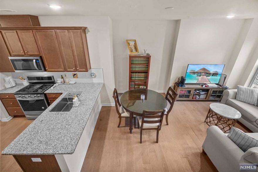 Sept 23rd MOVE-IN to this luxury 2 bed 2 bath townhome offering natural sunlight with NJ Transit train station & parks right at your doorstep! Features two levels of living space, gourmet kitchen with customized cabinets, granite counter-tops, backsplash and energy efficient SS appliances, hardwood floors throughout the main level, washer/dryer in unit and much more. The home comes with 1 car garage & 1 car in driveway. All life-style amenities including shopping, gyms, and super markets within a few mile commute. Ideal location for all major highways if not commuting by bus or train! Onsite park, athletic complex, coffee shop, liquor store, children's playground, tracks & fields for re-creation. Call now to see it in person.