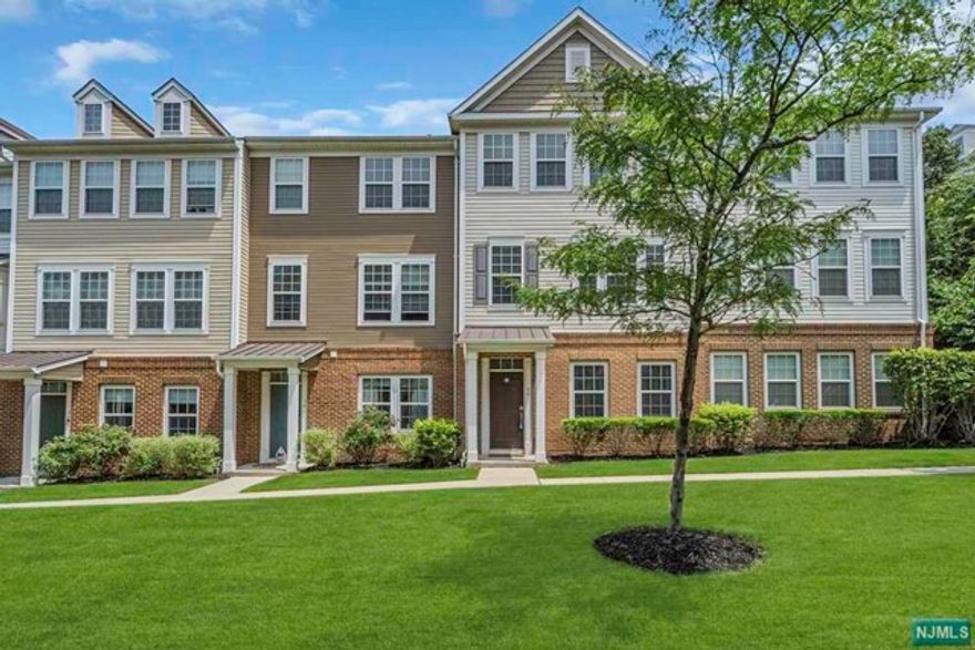 Spectacular 3 Level 3 Bedroom, 2.5 Bath Townhome at the beautiful Wesmont Station Community offering on site Train Service and a terrific location. This amazing home is sure to impress with loads of natural light. The ground Level features a Tile Entry Foyer, a Large Family Room or Office with Recessed Lighting, a Sep Utility Rm, and attached 2 car garage with direct access to the home. The main level offers Hardwood Floors Throughout and features a sensational Open Concept Living Rm, Dining Rm & Sensational Kitchen with Granite Counters, Stainless Steel Appliances, a Huge Island, and a Separate Cooktop & Wall Oven, a Huge Balcony and a convenient Half Bath. Upstairs you will find a Master Bedroom Suite with a Walk-in Closet, Master Bath with a Double Vanity & Separate Tub and Shower, 2 Additional Bedrooms both with Double Closets, a Second Full Bath and a convenient Laundry Area. Wesmont Station offers Playgrounds, On site shopping & is adjacent to the Wood-Ridge athletic complex