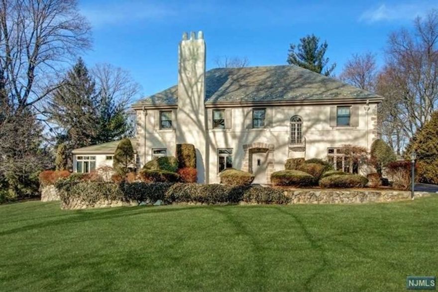 ONE OF RIDGEWOOD'S MOST ICONIC HOMES! CIRCA 1928 FRENCH INSPIRED COUNTRY HOUSE RENOVATED FOR TODAY'S MODERN LIVING. SET IN THE DESIRABLE RIDGE SCHOOL DISTRICT. RENOVATED KITCHEN&BATHRMS GORGEOUS CENTER HALL W/TURNED STAIRCASE LEADS TO EXPANSIVE LR W/FPL.UPDATED WHITE CUSTOM KITCHEN W/BUILT-IN BANQUETTE FEATURES STAINLESS STEEL APPLIANCES, DOUBLE OVENS AND ISLAND. BATHRMS HAVE WATERWORKS TILE, FIXTURES, SINKS. FORMAL DINING ROOM FLOWS TO ENORMOUS GREAT-ROOM ADDITION. FAMILY ENTERTAINING SPACE INCLUDES HIGH CEILINGS,WETBAR, FPL, SEPARATE ENTRANCE TO PATIO. GROUND FLOOR OFFICE/STUDY W/BUILT IN BOOKSHELVES/LEADED-GLASS WINDOWS. UPSTAIRS HAS PRIVATE MASTER SUITE W/MBTH, FPL, HIS/HER WIC, FBATH in HALLWAY. 3 BEDRMS &2ND HALL FULL BTH. UNFINISHED 3RD FLR COULD EASILY BE CONVERTED INTO 2 BEDRMS OR TEEN SUITE. DETACHED 3-CAR GARAGE UPDATED W/NEW GARAGE DOORS. GROUND LEVEL PATIO & BEAUTIFULLY LANDSCAPED GROUNDS. SOUGHT AFTER LOCATION CLOSE TO NYC TRAINS, VILLAGE AND SCHOOLS.