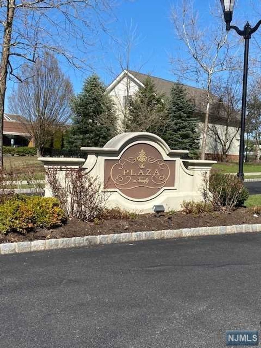 Welcome to The Plaza, Very well maintained luxurious gated community located in the heart of Tenafly. And conveniently located in close proximity to NJ Transit bus to NYC, schools, shops, and restaurants. This beautiful and sunny 1,692 SF duplex style with 2 bedrooms, 2 bath and additional den/playroom features 10' ceiling with crown moldings. Beautiful over size windows, designer kitchen with custom cabinets, granite counter tops, stainless steel Subzero and Viking appliances. Building Amenities includes, a fitness center, pool, BBQ areas, clubhouse with a billiard room and media room. 1 indoor & 1 outdoor parking space and 24 Hr security. Come see and make it your next Home !!