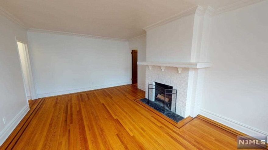 Don't miss this opportunity to own a rare two bedroom in well sought after Dwight Manor! Enter the foyer to hardwood floors leading you to the living space featuring a cozy fireplace. The kitchen is updated with granite counter tops, updated appliances and plenty of cabinet space. Each bedroom provides ample living and closet space. This unit comes with one deeded parking space! Move in condition! Come see it today! Being sold strictly as-is.