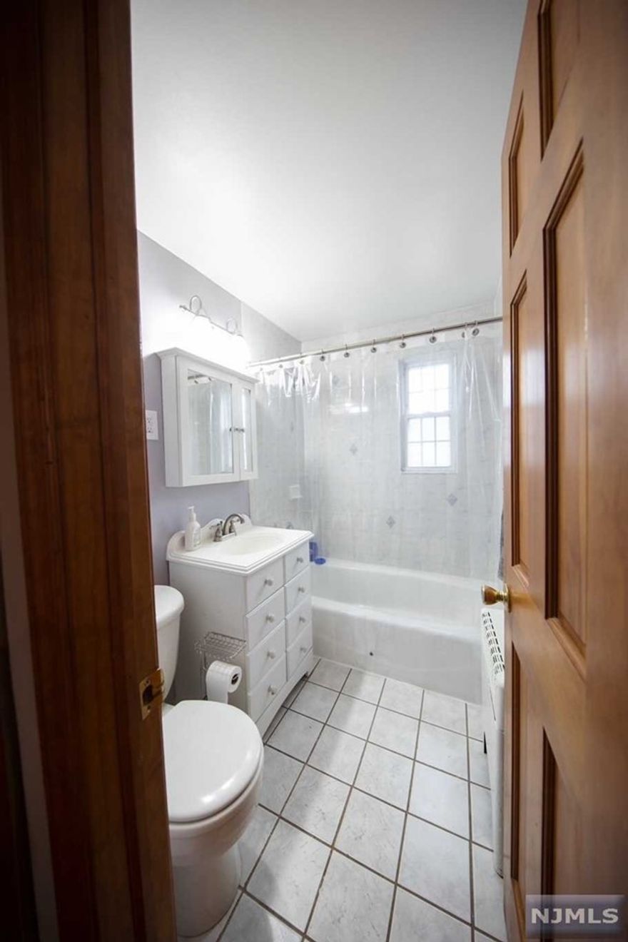 Beautiful sun drenched 1st floor end unit with gleaming hardwood floors throughout! Recessed lighting, Kitchen, dining room, living room, spacious bedroom and full bath. Plenty of closet space, and kitchen cabinets; Newer AC units, includes designated parking space, coin op laundry in complex.Heat included with maintenance, close to transportation and shopping, schools and local eateries.