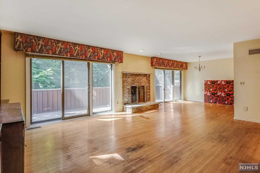 Potential abounds in this spacious two-bedroom, two full and one half bath townhouse surrounded by nature yet only minutes from bustling Upper Montclair's shops, restaurants, train, and bus. Open floor plan with Living Room, Dining Room, Kitchen, Pantry/Closet, and Powder Room with sliding doors opening onto your own private balcony. The second floor features a Primary Suite with an ensuite bathroom, a large walk-in closet, and a second balcony. Bedroom two is airy and the main bathroom is bright with a skylight. The roomy walk-out basement with high ceilings is ready to be finished with a third bedroom, bathroom, and family room. New Sliding doors throughout. Newer HVAC. Sold 'As Is' with no known issues.