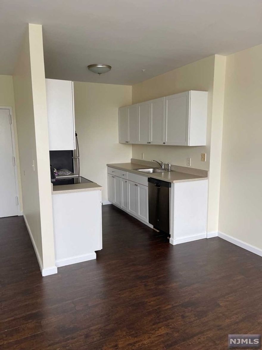 1 Bedroom apartment available on 2nd floor of elevator building. Apartments over the stores at Washington Commons Shopping Plaza adjacent to StopNShop. Vinyl flooring. Renovated galley kitchen with lots of cabinets, dishwasher and electric stove. Water is included in the rent, the Tenant pays the electricity. Bathroom with shower over a tub. Washer and Dryer in unit. Onsite Parking. NO smoking of any kind, no pets.