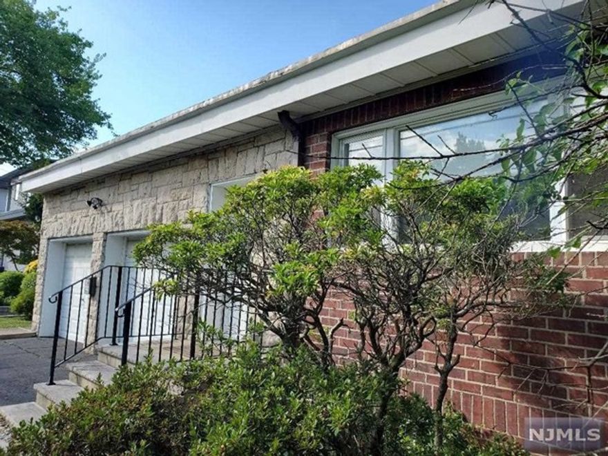 Only minutes away from the GW Bridge and NYC, is this well maintained four bedroom home with stone and brick exterior in gorgeous Englewood Cliffs. Enter into a gracious living room with stone fireplace and lots of windows. Living room flows into dining and kitchen with granite countertops and stainless steel appliances. First floor has a large bedroom and full bathroom. Upstairs is a primary suite, two additional large bedrooms and hall bath with tub/shower. Recessed lighting and hardwood floors throughout. Two car garage with high ceilings and storage. The basement is partially finished with laundry. Beautiful backyard with a stone patio for entertainment and ample green space for play. Convenient to transportation, shopping and schools.