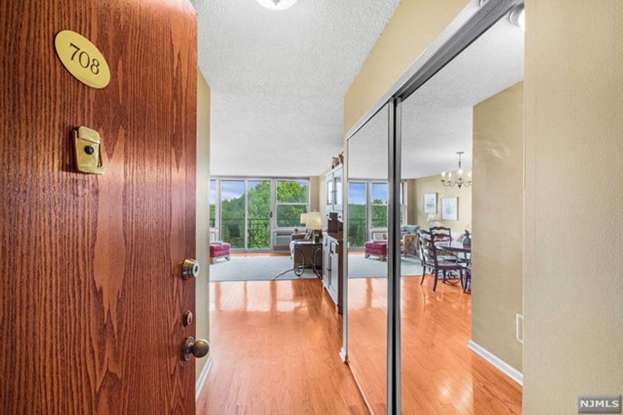 Welcome to the Mill!! Wake up to these breathtaking views from this 2 bedroom 2 full bath condo. This unit is equipped with hardwood floors throughout and windows that allows you to take in these gorgeous views from every room you enter. This spacious living room also offers a large sliding glass door that opens up to a large balcony which is the perfect spot to relax after a long day. The primary bedroom has a huge walk in closet and also primary bath. The second bedroom makes a guest room or an at home office. The second bedroom is also equipped with a very large closet that allows for ample storage. The Mill offers 12 acres of property including a stunning gym/community room, swimming pool, and walking path. NJ Transit bus/trains are located across the street!