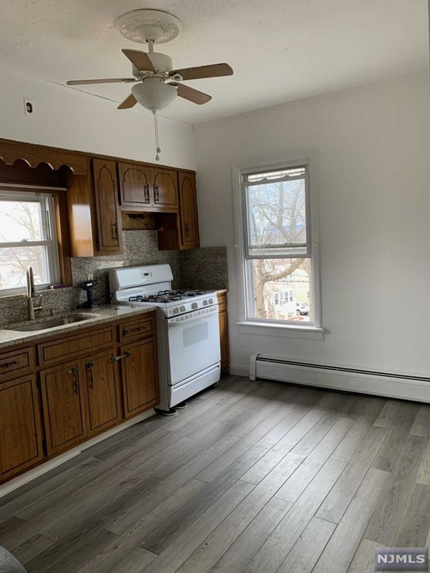 Second Floor 2/3 Bedroom apartment features LR, Eat-In-Kitchen and Full Tiled Bath, walk up to finished 3rd floor with possible bedroom and storage space. No Refrigerator provided. Tenant has 2 parking spaces in driveway. Tenant pays own utilities including water. Landlord requires credit check, rental application and proof of ability to pay rent. Within walking distance to NYC transportation. Available immediately. Sorry "NO PETS"