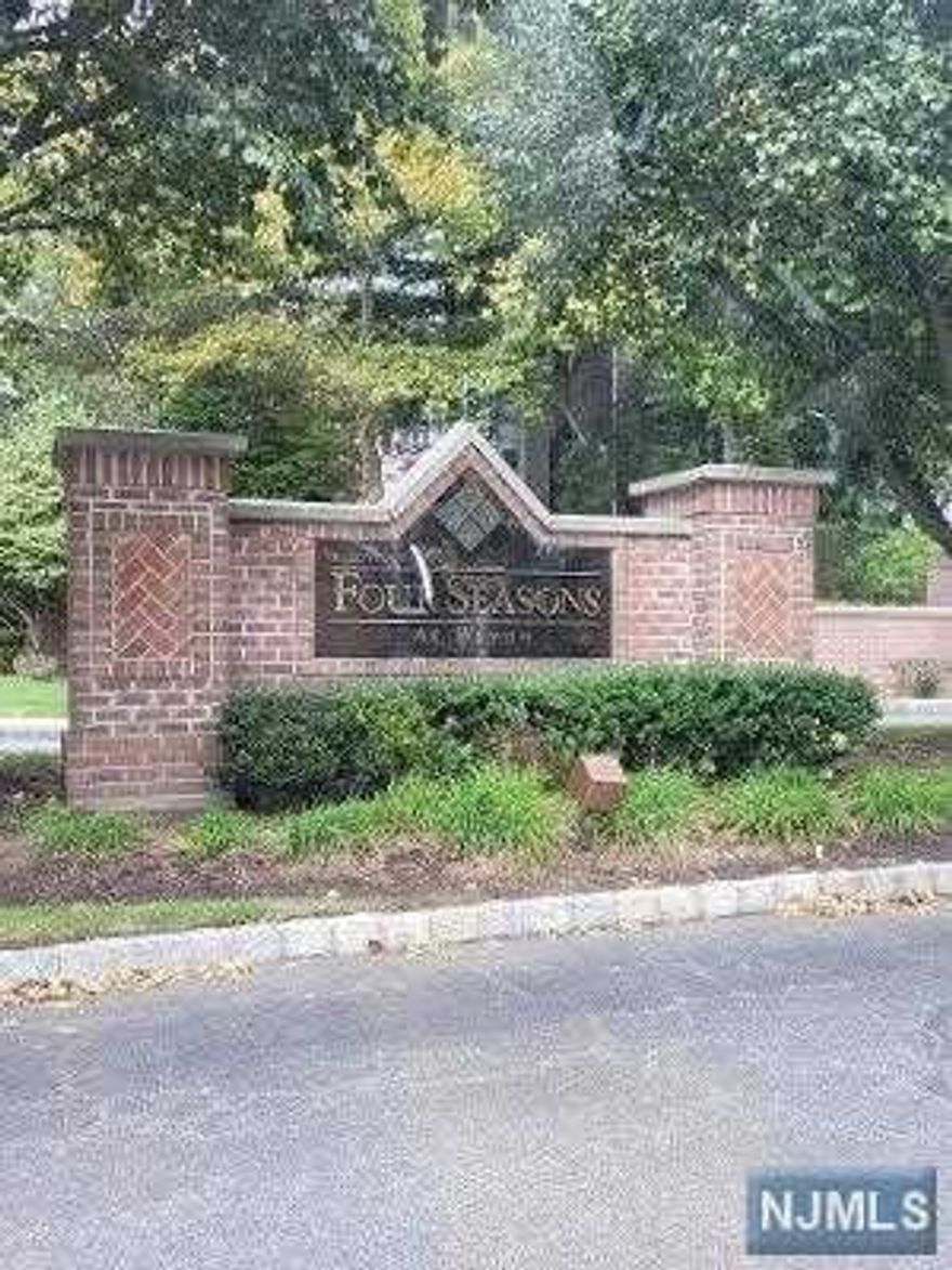 Move into this Sunny and Bright 1st fl. END unit. Great Lifestyle right here in Wayne, 55 yr. Active Adult community. Walk into a large living/dining rm. with high ceilings, and large windows, Large Master Br. with walk in closet. 2nd bedroom, large full bath in hall. Also, Storage rm. in unit. Utility room with storage, also Storage rm. outside door in hall. Featuring a Clubhouse, pool, tennis, billiard's, bocce court, and Fitness Center. Convenient assigned indoor garage with storage and elevator to unit. Close to NY Trans., YMCA, Shopping