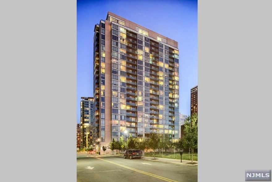 2 Bed, 2 Bath with a Private Balcony! Flooded with natural sunlight. A Large Gourmet Kitchen features a brand new oven, updated appliances, granite countertops. Hardwood floors throughout, Central Air & in-unit washer/dryer rounds out this beautiful home. All amenities included: 24/7 concierge, fitness center, jacuzzi, sauna, stream room, resident lounge, conference room, playroom & a roof deck with amazing NYC/River views! Experience the convenience of Newport! Located between the Newport & Hoboken PATH, Ferry, NJ Transit Train, Light Rail and Bus Terminal.