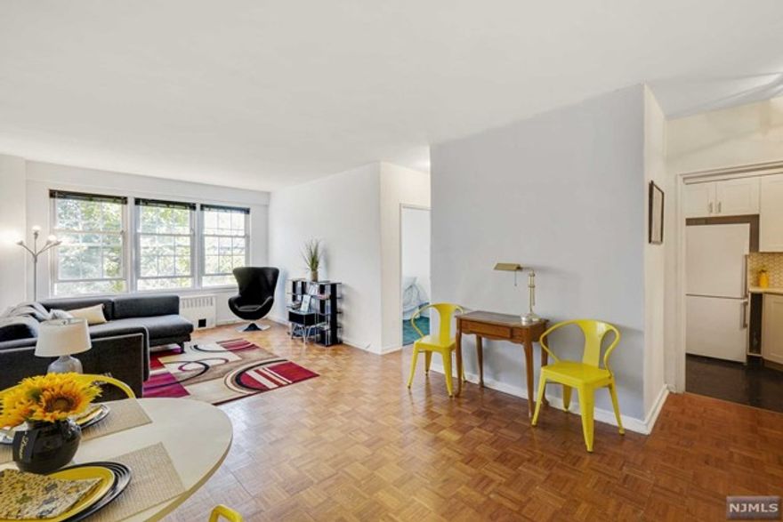 Why rent when you can own in Montclair! This amazing downtown location across the street from the Public Library is in the new Seymour Arts District! This condo has a sunny, eastern exposure, and features hardwood flooring with updated kitchenette and bath! This condo also makes for one great investment! The Fullerton is a well maintained elevator building with intercom entry, onsite laundry, storage and concierge services. Maintenance includes heat and water. You are in the heart of Montclair! Nearby Bloomfield Ave and Church St...shops, restaurants and entertainment are in your 'backyard' as is the Farmer's Market and the Walnut St train! You won't need a car in this neighborhood but if you have one there are on-street parking/monthly parking options available. Sorry no dogs allowed in the building. *SOLD AS IS*