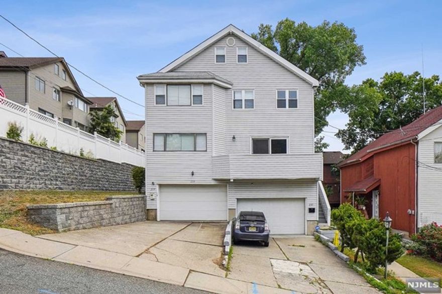 Great location, near schools, parks and shopping centers. A few minutes from GWB and NYC. 4 Bedroom, 2 full baths and 2 powder rooms. Large eat-in Kitchen. Spacious family room on ground level, open to backyard. New Refrigerator and Over-Range/Gas. Newly re-finished floors, newly painted interiors. Ready to move in!