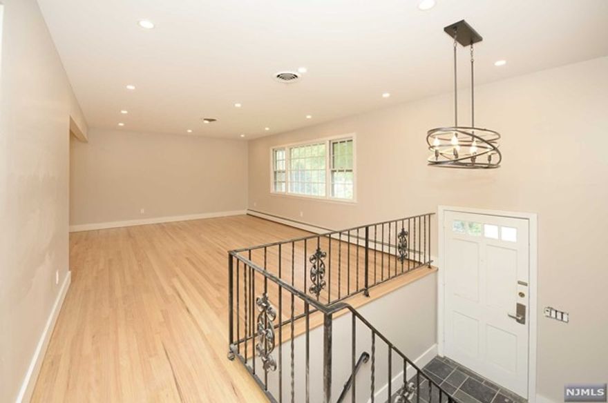 Welcome to your dream rental home in Fair Lawn, ideally located near top schools, parks, shopping, dining, and convenient transportation routes. This pristine 4-bedroom, 3-bathroom residence has been thoughtfully renovated to blend modern luxury with comfort. As you enter, an elegant foyer welcomes you, adorned with a stylish chandelier. Upstairs, discover a newly designed kitchen featuring stainless steel appliances, perfect for culinary enthusiasts. A spacious dining room, sun lit living room, & 3 generously sized bedrooms, along with 2 full bathrooms, complete this level. The ground floor offers a private bedroom, another full bathroom, and a large family room, perfect for relaxing or entertaining. Additionally, this level provides access to a 2-car garage, offering convenience and ample storage. This home's desirable location and exquisite features make it an ideal choice. Don't miss the opportunity to call this beautiful property your home.