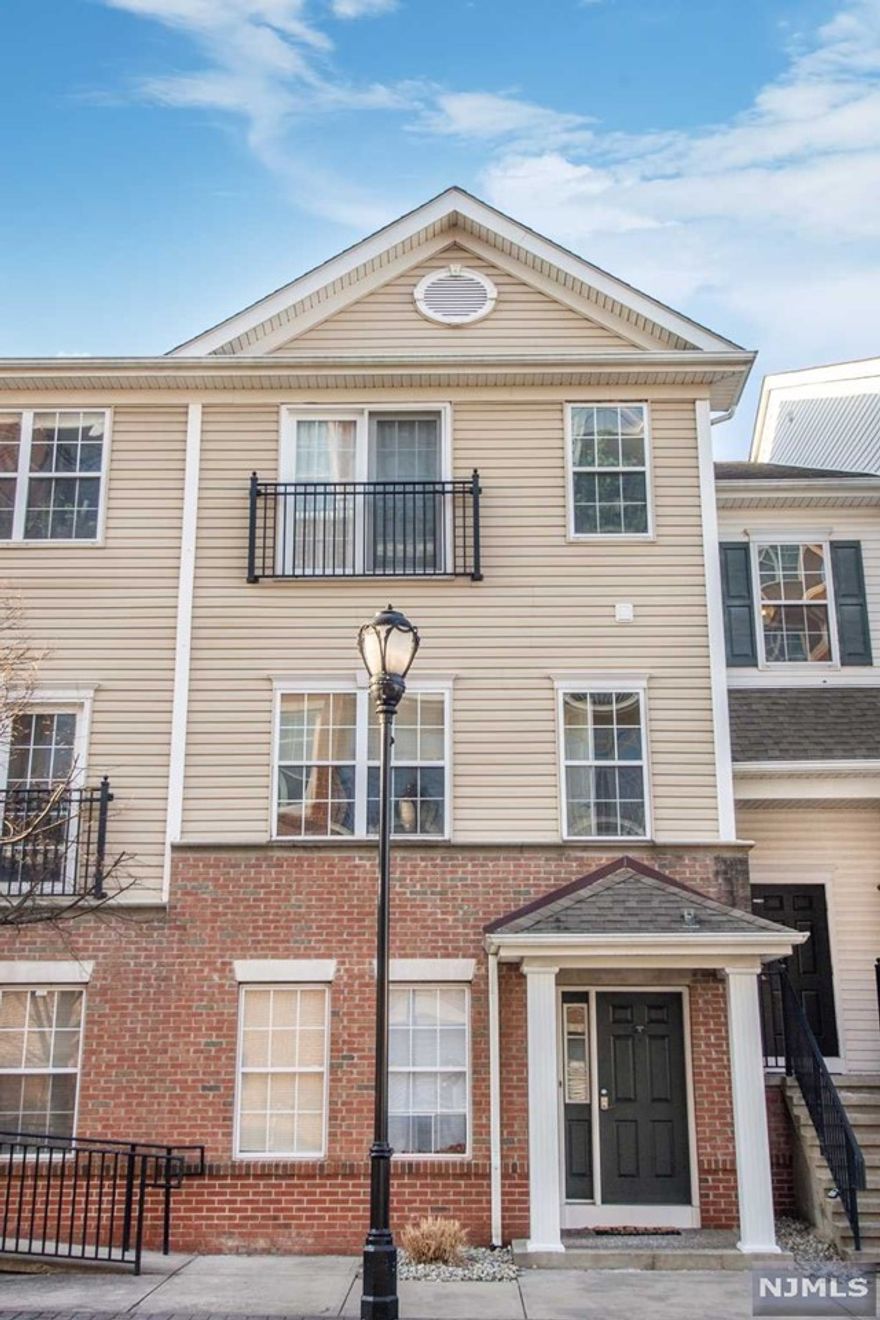 A commuter's dream! This young townhouse, originally built in 2005, is located only 1.5 blocks to the Bergen-Hudson Light rail. Boasting 1,428 sq ft, this unit has it all- in-unit washer/dryer, breakfast bar, terrace, and garage parking! Bonus family room on 1st floor with direct access to garage, and laundry room. Second floor features two bedrooms and two bathrooms with spacious eat-in kitchen and open floor plan living/dining room with access to terrace. Central AC/heating throughout and pet friendly. Low taxes due to tax abatement for remaining few years from when originally built, can be confirmed directly with Jersey City tax assessor.
