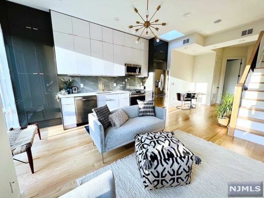 **Tax Abatement and Builder Warranty** Don't miss out! Brand New Construction offering gorgeous design and finishes. This cool and modern space offers 2 bedrooms, 2 bathrooms, 10ft ceilings, sleek overside windows, a welcoming floorpan, built in surround sound and pre-wired for internet. ...and a PRIVATE AND VERY SPACIOUS ROOF DECK! The kitchen features a beautiful backsplash with complimenting quartz countertops, high gloss cabinets, and gold accent hardware. An open concept living and dining space that leads up to a very large, PRIVATE 900 square foot ROOF DECK with city views. The perfect space for entertaining or relaxing on the weekends. Past the common living space is a full bathroom followed by a guest room or office. The main bedroom is private and set back with of course an attractive on suite bathroom. All rooms offer sleek oversized windows and tremendous natural light. Located in a growing community right outside of NYC.Close to parks and only a Walk to the Lightrail