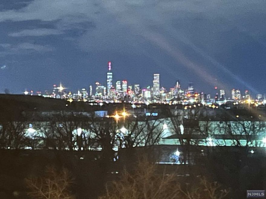 Opportunity is knocking! Highly sought after 1 bedroom unit with stunning NYC skyline views. Spacious bedroom offering two closets. Bright living room opens to eat-in-kitchen and balcony. In-unit washer/dryer, full bath and one car garage plus an outdoor assigned space! Updated central air conditioning and hot water heater. Excellent location for commuting. Minutes from Harrison Path Station and close to shopping and other NYC transportation.